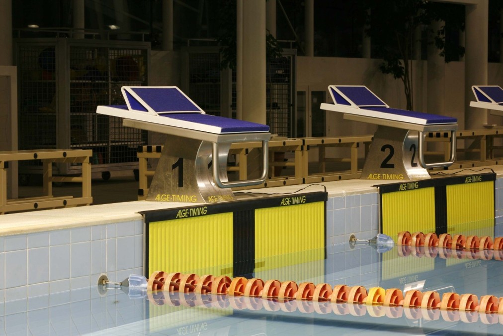 Starting blocks at an indoor Olympic swimming pool