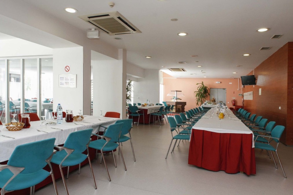 Dining hall with set tables and buffet stations
