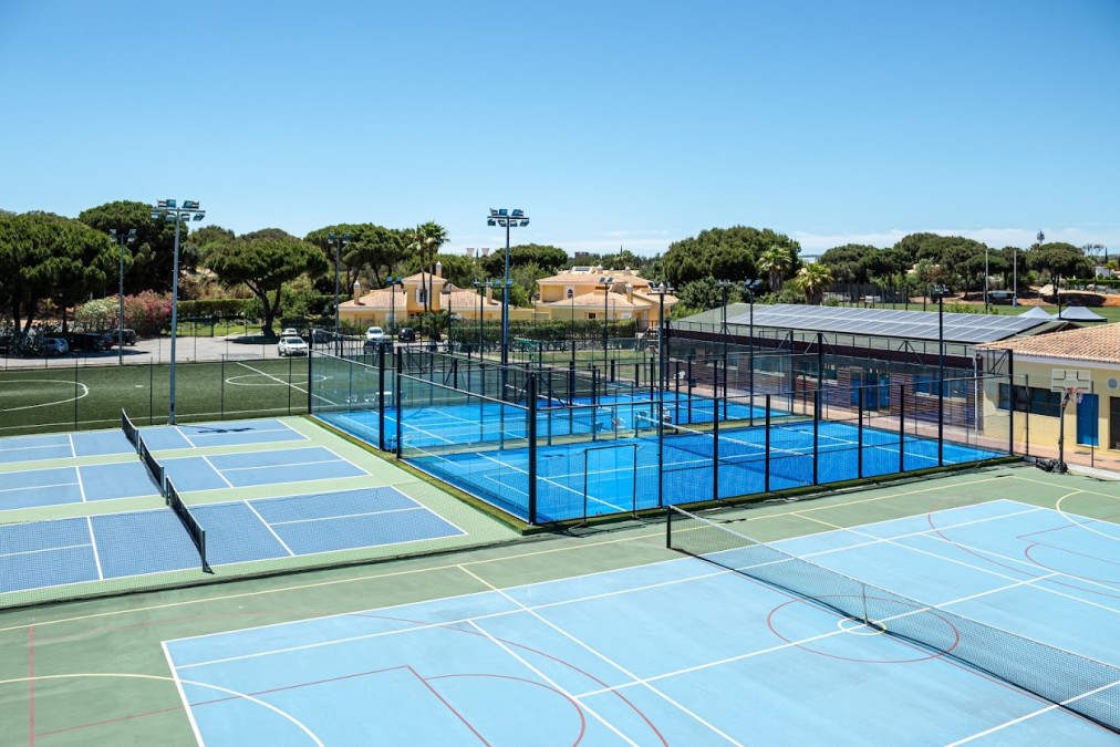 Wide view of tennis, padel and football facilities for a training camp.