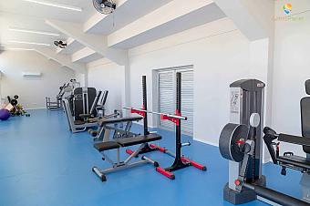 Modern gym with strength and cardio machines for athlete workouts