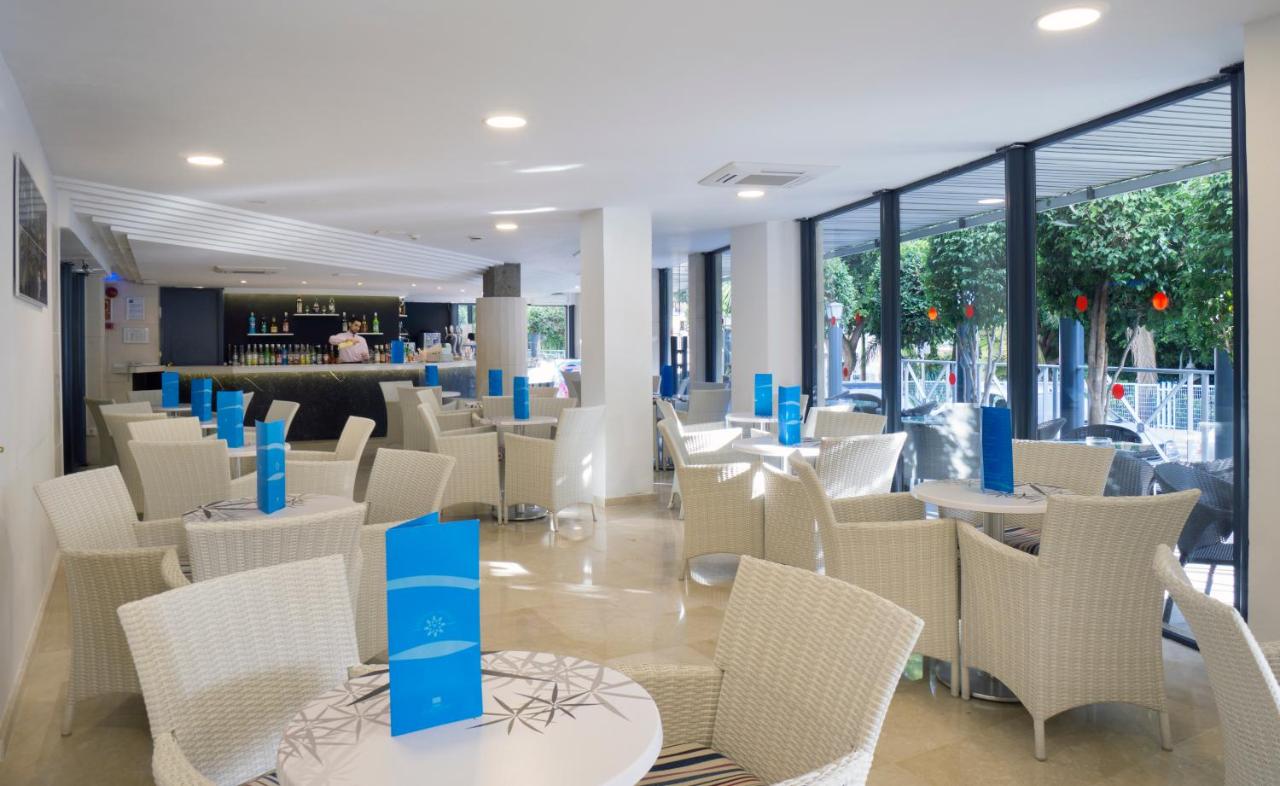 Indoor dining area with bar counter and terrace access