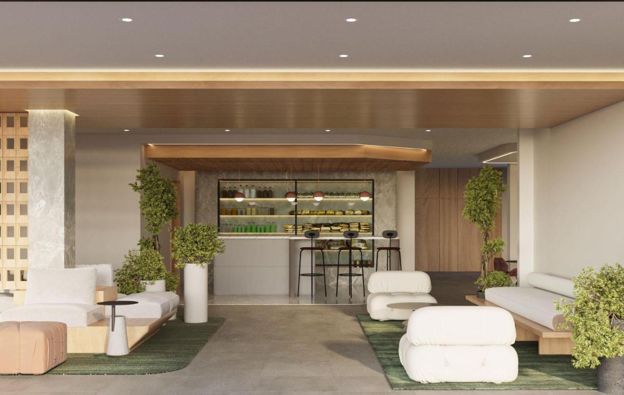 Resort bar area with seating, plants, and modern lighting