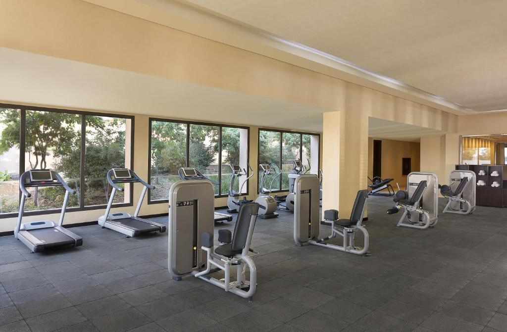 Fitness room with treadmills, cardio machines, and strength equipment for workouts.