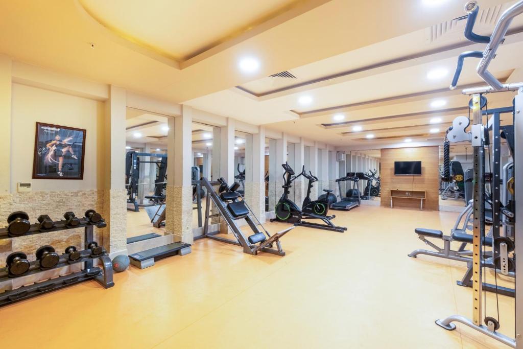 Gym with dumbbells, cardio machines and strength stations for training camp workouts.