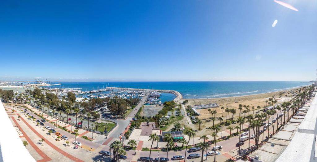 Panoramic view of the marina, beach and seafront.